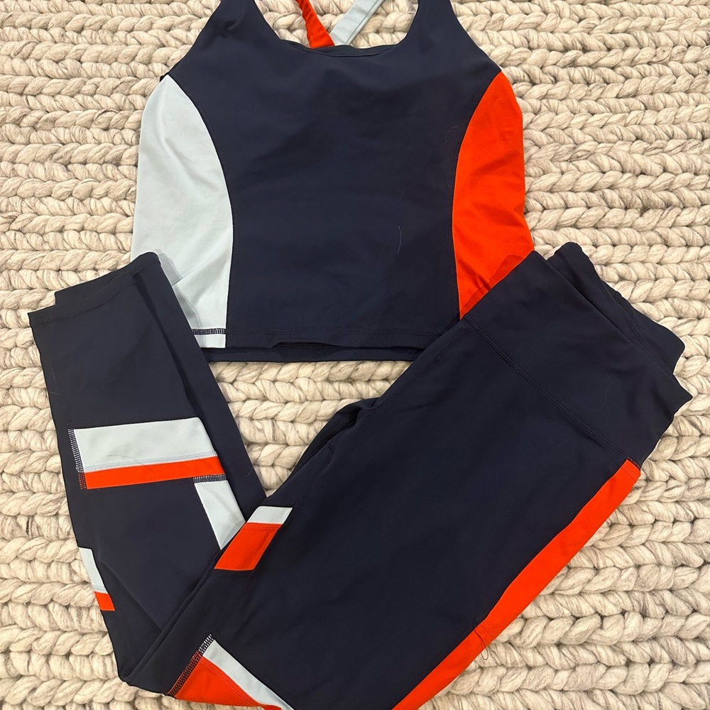 Sweaty Betty Navy Leggings and Cropped Bra top with Orange and light blue detail